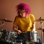 Animal, the Muppet drummer, playing drums